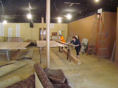Volunteers are seen working on a set behind the scenes at Maples Repertory Theatre in Macon, Missouri.