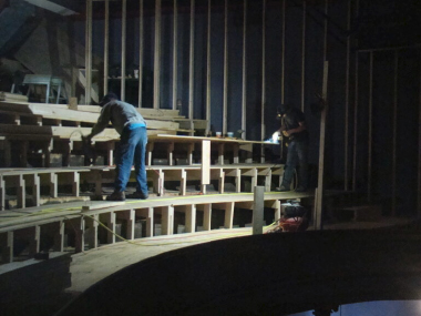 Crew working on a set inside the historic Royal Theatre in downtown Macon, Missouri